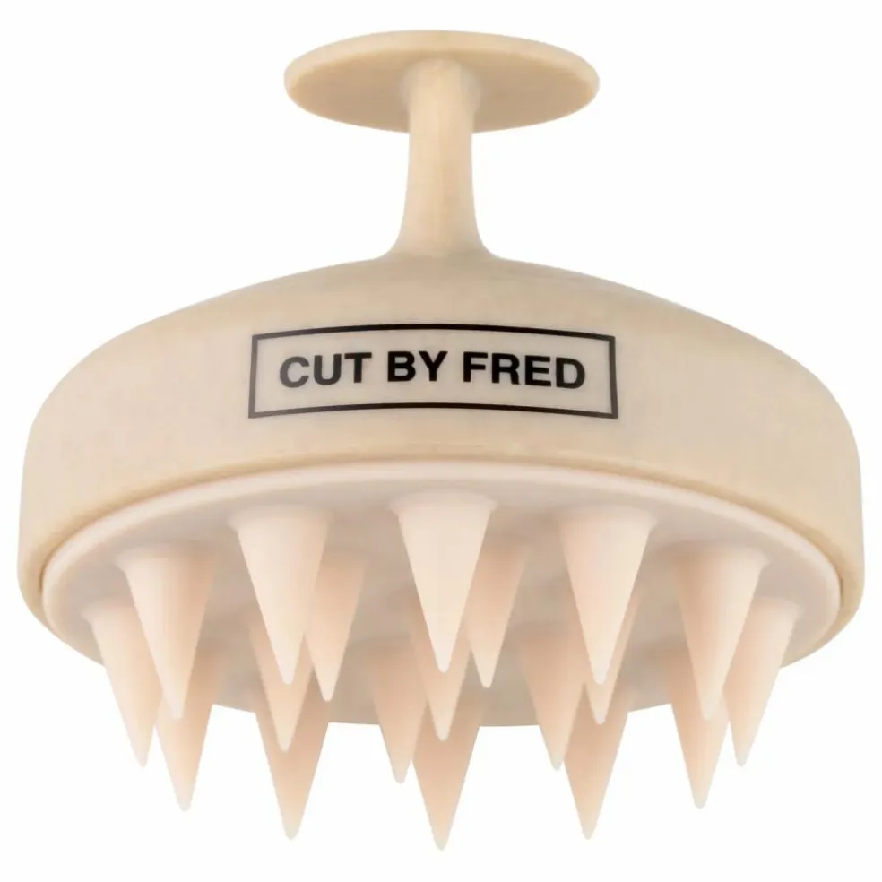 Brosse stimulante pour le cuir chevelu