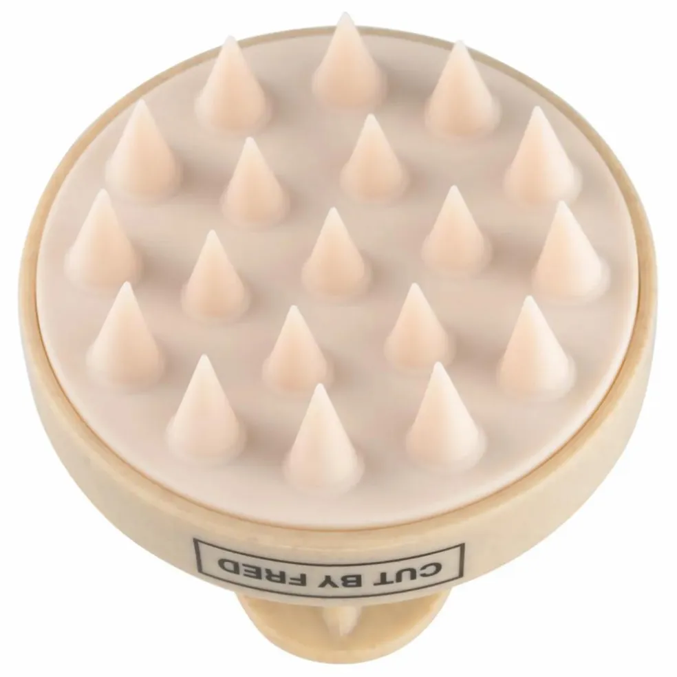 Brosse stimulante pour le cuir chevelu